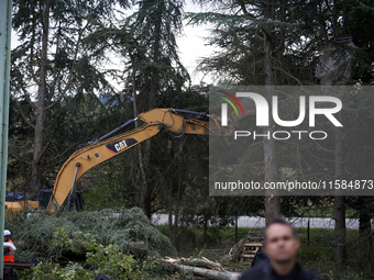 A Gendarme stands guard as an excavator destroys trees at the 'Verger' ZAD. For the second day, Gendarmerie and CNAMO try to dislodge 'Ecure...