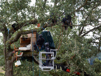 Members of the CNAMO, a special police unit, catch an 'Ecureuil' (i.e., 'squirrel'). For the second day, Gendarmerie and CNAMO try to dislod...