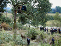 Gendarmes block access to an oak occupied by a 'squirrel' at the 'Verger' ZAD. For the second day, Gendarmerie and CNAMO try to dislodge 'sq...