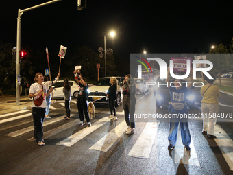 Israeli protesters block Herzog Street in West Jerusalem, near Prime Minister Netanyahu's residence, calling for an end to the war and the i...