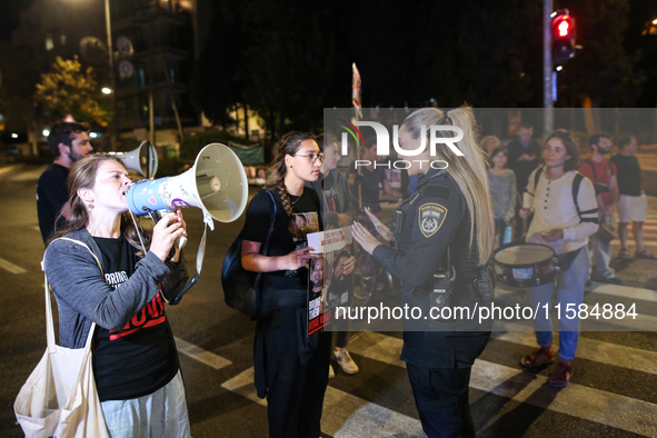 Israeli protesters block Herzog Street in West Jerusalem, near Prime Minister Netanyahu's residence, calling for an end to the war and the i...