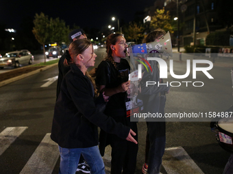 Israeli protesters block Herzog Street in West Jerusalem, near Prime Minister Netanyahu's residence, calling for an end to the war and the i...