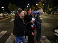 Israeli protesters block Herzog Street in West Jerusalem, near Prime Minister Netanyahu's residence, calling for an end to the war and the i...