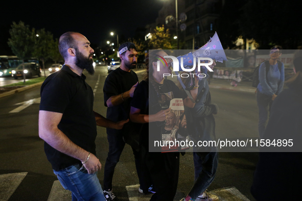 Israeli protesters block Herzog Street in West Jerusalem, near Prime Minister Netanyahu's residence, calling for an end to the war and the i...