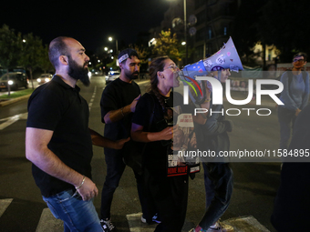 Israeli protesters block Herzog Street in West Jerusalem, near Prime Minister Netanyahu's residence, calling for an end to the war and the i...