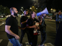 Israeli protesters block Herzog Street in West Jerusalem, near Prime Minister Netanyahu's residence, calling for an end to the war and the i...