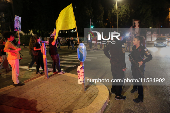 Israeli protesters block Herzog Street in West Jerusalem, near Prime Minister Netanyahu's residence, calling for an end to the war and the i...