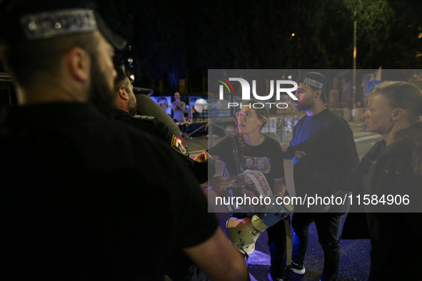 Israeli protesters block Herzog Street in West Jerusalem, near Prime Minister Netanyahu's residence, calling for an end to the war and the i...