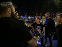 Israeli protesters block Herzog Street in West Jerusalem, near Prime Minister Netanyahu's residence, calling for an end to the war and the i...