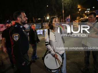 Israeli protesters block Herzog Street in West Jerusalem, near Prime Minister Netanyahu's residence, calling for an end to the war and the i...