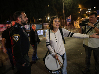 Israeli protesters block Herzog Street in West Jerusalem, near Prime Minister Netanyahu's residence, calling for an end to the war and the i...