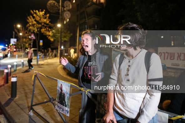 Israeli protesters block Herzog Street in West Jerusalem, near Prime Minister Netanyahu's residence, calling for an end to the war and the i...