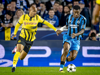 Borussia Dortmund forward Donyell Malen and Club Brugge midfielder Raphael Onyedika during the match between Club Brugge and Borussia Dortmu...