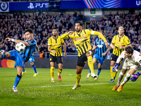 Club Brugge midfielder Hugo Vetlesen, Borussia Dortmund defender Emre Can, and Borussia Dortmund goalkeeper Gregor Kobel during the match be...