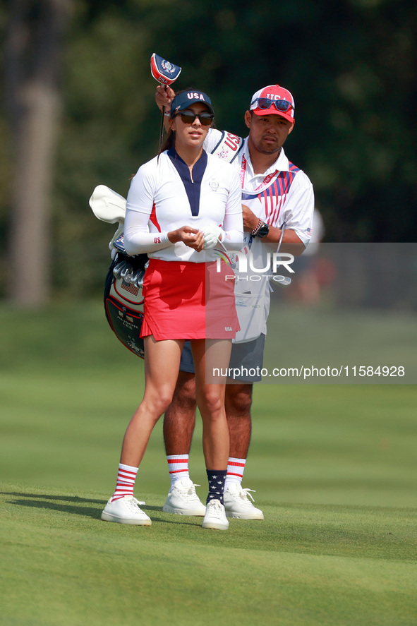 GAINESVILLE, VIRGINIA - SEPTEMBER 15: Alison Lee of the United States and her caddie look down the 13th fairway during the final round of th...