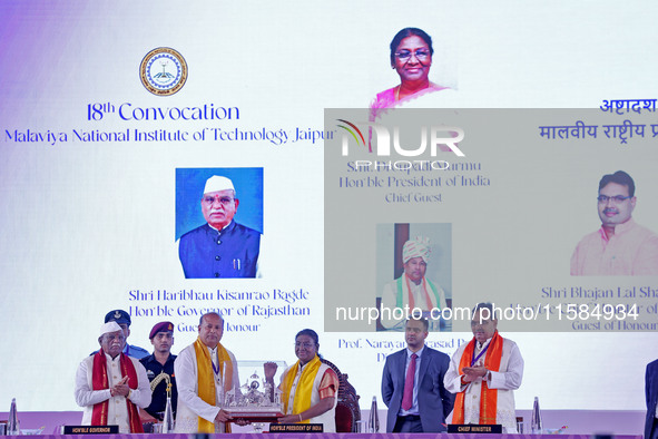 President Droupadi Murmu is welcomed by Director MNIT Prof. Narayana Prasad Padhy during the 18th Convocation ceremony at Malviya National I...