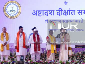 President Droupadi Murmu presents certificates to students during the 18th Convocation ceremony at Malviya National Institute of Technology...