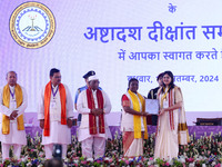 President Droupadi Murmu presents certificates to students during the 18th Convocation ceremony at Malviya National Institute of Technology...