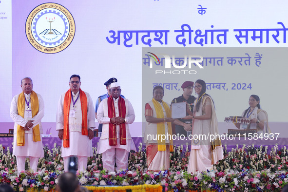 President Droupadi Murmu presents certificates to students during the 18th Convocation ceremony at Malviya National Institute of Technology...