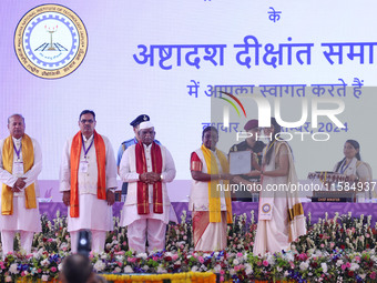 President Droupadi Murmu presents certificates to students during the 18th Convocation ceremony at Malviya National Institute of Technology...