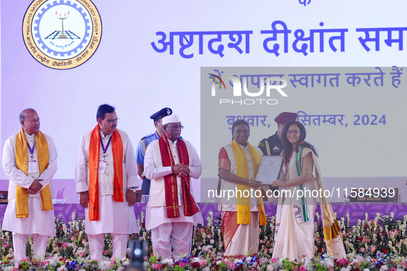 President Droupadi Murmu presents certificates to students during the 18th Convocation ceremony at Malviya National Institute of Technology...