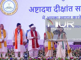 President Droupadi Murmu presents certificates to students during the 18th Convocation ceremony at Malviya National Institute of Technology...