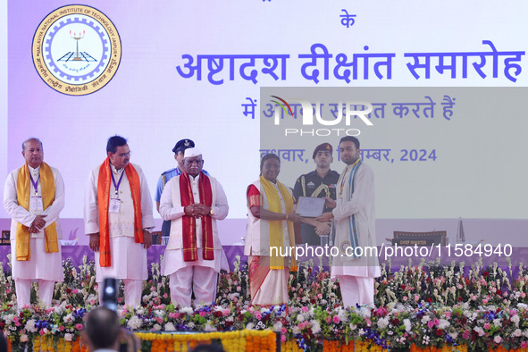 President Droupadi Murmu presents certificates to students during the 18th Convocation ceremony at Malviya National Institute of Technology...