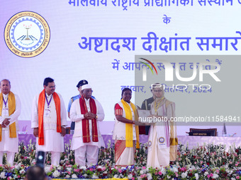 President Droupadi Murmu presents certificates to students during the 18th Convocation ceremony at Malviya National Institute of Technology...