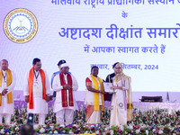 President Droupadi Murmu presents certificates to students during the 18th Convocation ceremony at Malviya National Institute of Technology...