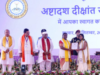 President Droupadi Murmu presents certificates to students during the 18th Convocation ceremony at Malviya National Institute of Technology...