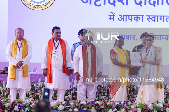 President Droupadi Murmu presents certificates to students during the 18th Convocation ceremony at Malviya National Institute of Technology...