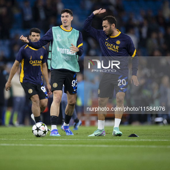 Alessandro Bastoni #95 of Inter Milan warms up during the UEFA Champions League Group Stage match between Manchester City and Football Club...