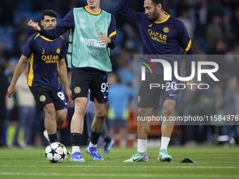 Alessandro Bastoni #95 of Inter Milan warms up during the UEFA Champions League Group Stage match between Manchester City and Football Club...