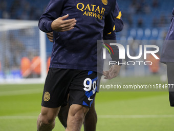 Mehdi Taremi #99 of Inter Milan warms up during the UEFA Champions League Group Stage match between Manchester City and Football Club Intern...