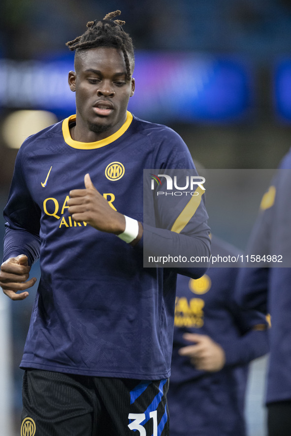 Yann Aurel Bisseck #31 of Inter Milan warms up during the UEFA Champions League League Stage match between Manchester City and Football Club...