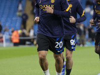 Hakan Calhanoglu #20 of Inter Milan warms up during the UEFA Champions League Group Stage match between Manchester City and Football Club In...