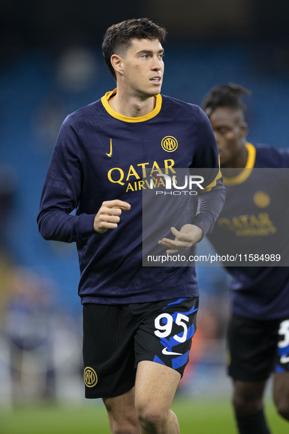 Alessandro Bastoni #95 of Inter Milan warms up during the UEFA Champions League Group Stage match between Manchester City and Football Club...