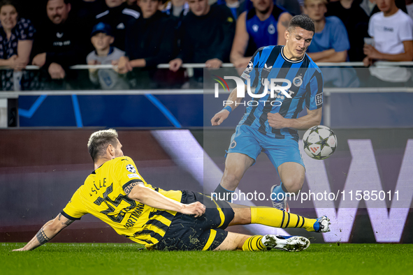 Borussia Dortmund defender Niklas Sule and Club Brugge forward Christos Tzolis during the match between Club Brugge and Borussia Dortmund at...