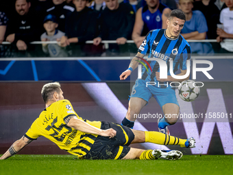 Borussia Dortmund defender Niklas Sule and Club Brugge forward Christos Tzolis during the match between Club Brugge and Borussia Dortmund at...