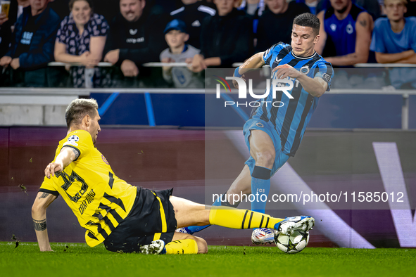 Borussia Dortmund defender Niklas Sule and Club Brugge forward Christos Tzolis during the match between Club Brugge and Borussia Dortmund at...