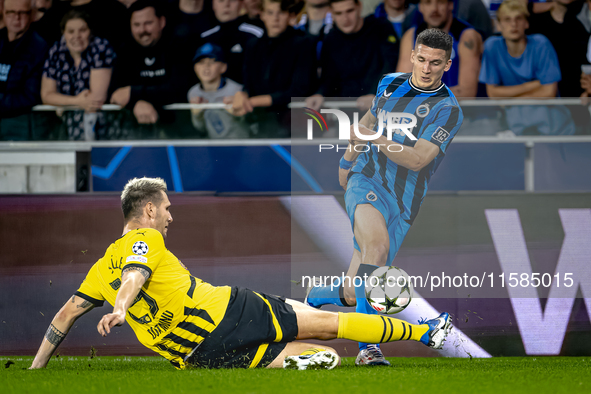 Borussia Dortmund defender Niklas Sule and Club Brugge forward Christos Tzolis during the match between Club Brugge and Borussia Dortmund at...