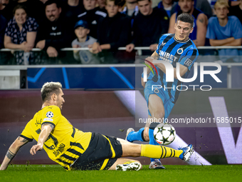 Borussia Dortmund defender Niklas Sule and Club Brugge forward Christos Tzolis during the match between Club Brugge and Borussia Dortmund at...