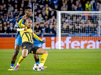 Borussia Dortmund forward Donyell Malen and Club Brugge midfielder Raphael Onyedika during the match between Club Brugge and Borussia Dortmu...