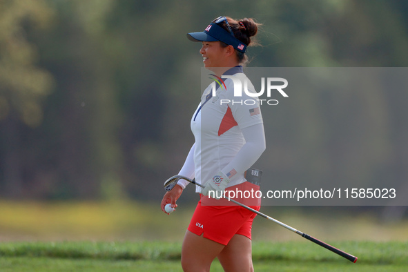 GAINESVILLE, VIRGINIA - SEPTEMBER 15: Megan Khang of the United States walks on the 13th green during the final round of the Solheim Cup at...