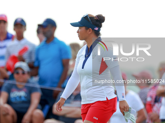 GAINESVILLE, VIRGINIA - SEPTEMBER 15: Megan Khang of the United States walks on the 13th green during the final round of the Solheim Cup at...