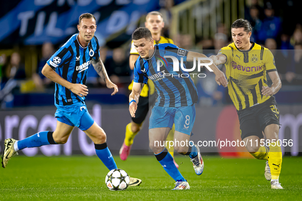 Club Brugge forward Christos Tzolis and Borussia Dortmund defender Marcel Sabitzer during the match between Club Brugge and Borussia Dortmun...