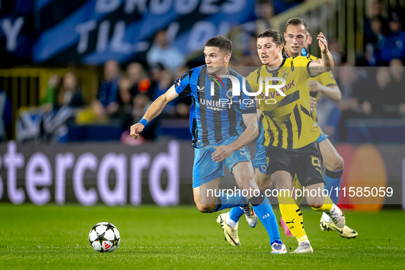 Club Brugge forward Christos Tzolis and Borussia Dortmund defender Marcel Sabitzer during the match between Club Brugge and Borussia Dortmun...