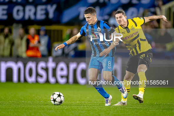 Club Brugge forward Christos Tzolis and Borussia Dortmund defender Marcel Sabitzer during the match between Club Brugge and Borussia Dortmun...