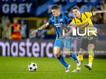 Club Brugge forward Christos Tzolis and Borussia Dortmund defender Marcel Sabitzer during the match between Club Brugge and Borussia Dortmun...