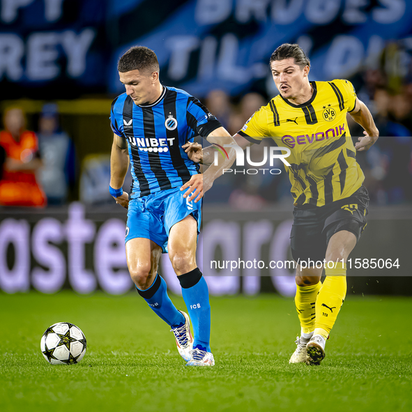 Club Brugge forward Christos Tzolis and Borussia Dortmund defender Marcel Sabitzer during the match between Club Brugge and Borussia Dortmun...